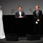 Tom Cruise speaks onstage as Artistic Director of DIFF Masoud Amralla Al Ali (L) and director Brad Bird and actor Simon Pegg (R) look on ahead of the "Mission: Impossible - Ghost Protocol" Premiere